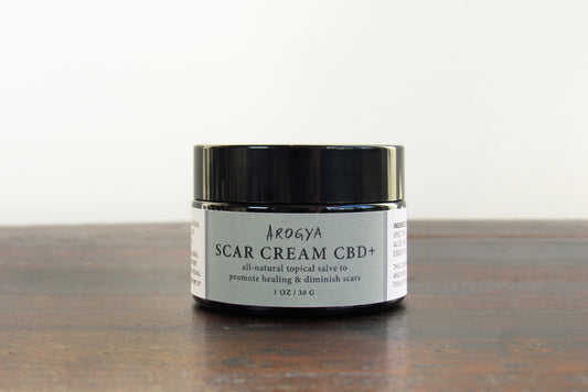 Jar of Arogya's Scar Cream CBD+ for diminishing scars