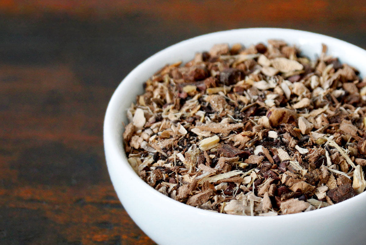 Arogya Adrenal Support wellness tea blend in a white bowl